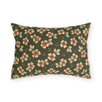 Cream blossoms with rust centres on a deep olive outdoor lumbar pillow, block print floral