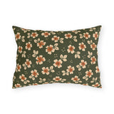 Cream blossoms with rust centres on a deep olive outdoor lumbar pillow, block print floral