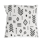 Black and white mudcloth outdoor pillow with hand-drawn arrows, diamonds and dashes in charcoal on warm white