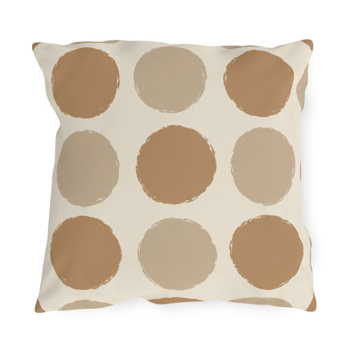 Neutral polka dot outdoor pillow with large camel and sand dots on cream