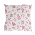 Pink beanies, mittens, cocoa mugs and snowflakes on white outdoor pillow