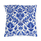 Cobalt blue delft damask pattern on a white outdoor pillow