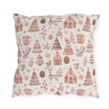Pink patterned Christmas trees, deer, gingerbread houses and cocoa mugs on cream outdoor pillow