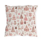 Pink patterned Christmas trees, deer, gingerbread houses and cocoa mugs on cream outdoor pillow