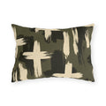 Cream and black brushstroke crosses on an olive green outdoor lumbar pillow