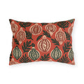 Block-printed cream and green Christmas baubles on red outdoor lumbar pillow