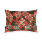 Block-printed cream and green Christmas baubles on red outdoor lumbar pillow