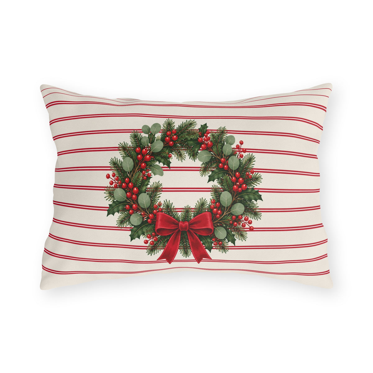 Christmas wreath outdoor lumbar pillow with a pine and berry wreath and red bow on cream with cranberry pinstripes