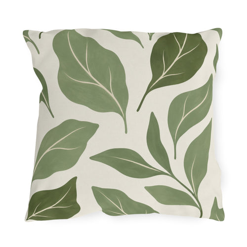 Sage green outdoor pillow with large abstract sage and olive leaves on off-white