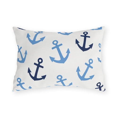 Nautical outdoor lumbar pillow with tossed light blue and navy anchors on bright white