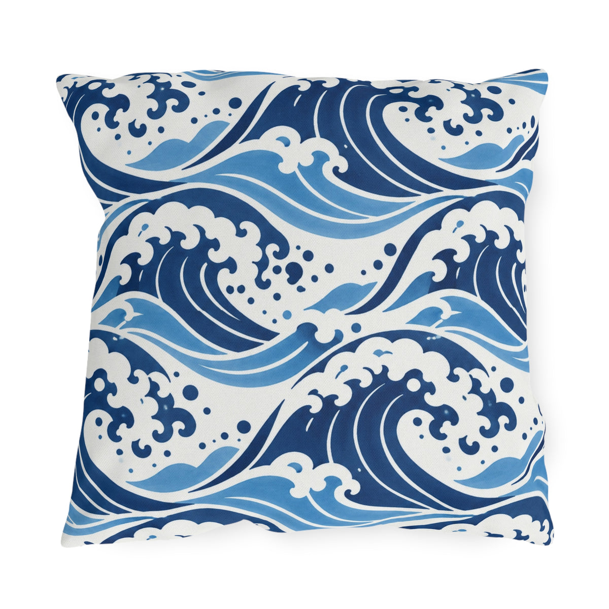 Coastal outdoor pillow with rolling navy and sky blue ocean waves and white foam crests