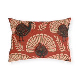 Block print turkeys and cream leaf sprigs on a brick red outdoor lumbar pillow