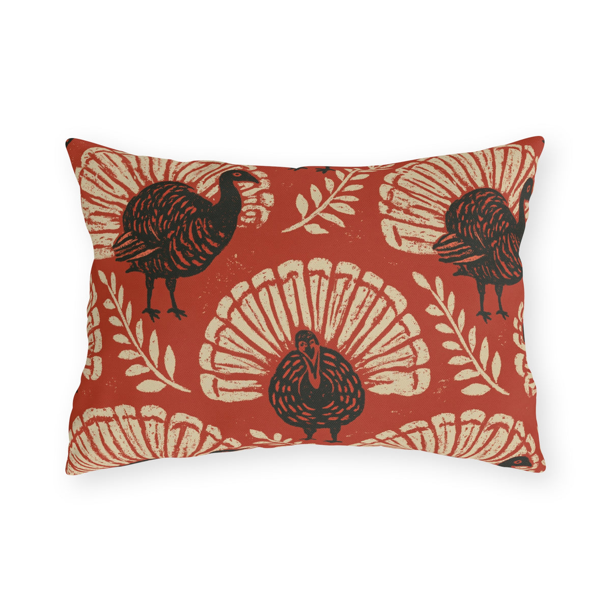 Block print turkeys and cream leaf sprigs on a brick red outdoor lumbar pillow