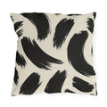 Black and cream outdoor pillow with loose abstract black brush strokes