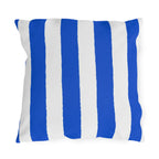 Blue and white awning stripe outdoor pillow with wide royal blue stripes on white