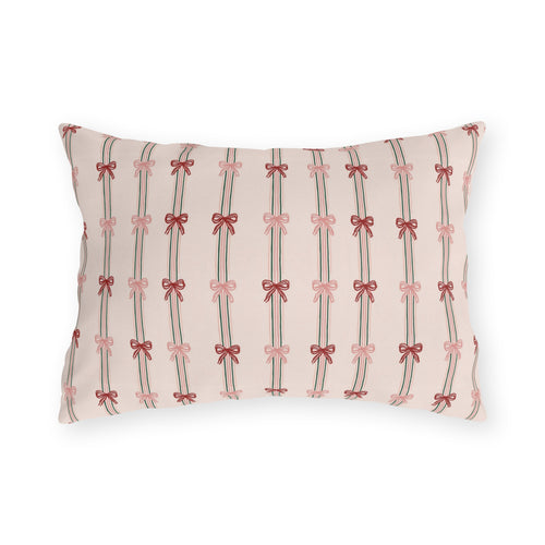 Pink and red ribbon bows on striped blush outdoor lumbar pillow