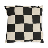 Black and cream checkerboard outdoor pillow with large hand-painted squares