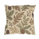 Cedar, spruce and pinecones in sage and brown on a cream outdoor pillow