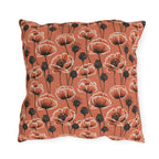 Coral poppies and black seed heads on terracotta outdoor pillow