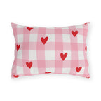Light pink gingham outdoor lumbar pillow with small red hearts