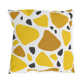 Yellow terrazzo outdoor pillow with large yellow and ochre stones and charcoal chips on white