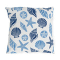 Coastal outdoor pillow with navy and sky blue seashells, starfish and sand dollars on white