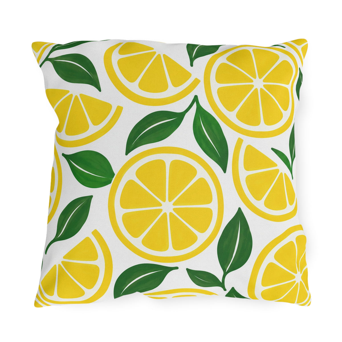 Yellow outdoor pillow with lemon slices and green leaves on white
