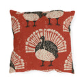 Black and cream block print turkeys on a brick red outdoor pillow
