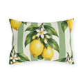 Watercolor lemons with leaves and white blossoms on a sage green and cream striped outdoor lumbar pillow