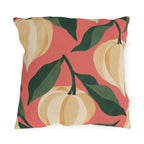 Fall outdoor pillow with cream and golden Chinese lantern pods and dark green leaves on coral pink
