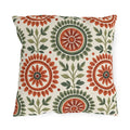 Block print floral outdoor pillow with folk flower medallions in terracotta and sage green with leafy sprigs on cream
