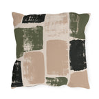 Olive, charcoal and clay brushed blocks on a cream outdoor pillow