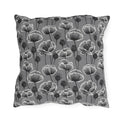 White and charcoal poppies and seed heads on grey outdoor pillow