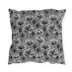 White and charcoal poppies and seed heads on grey outdoor pillow