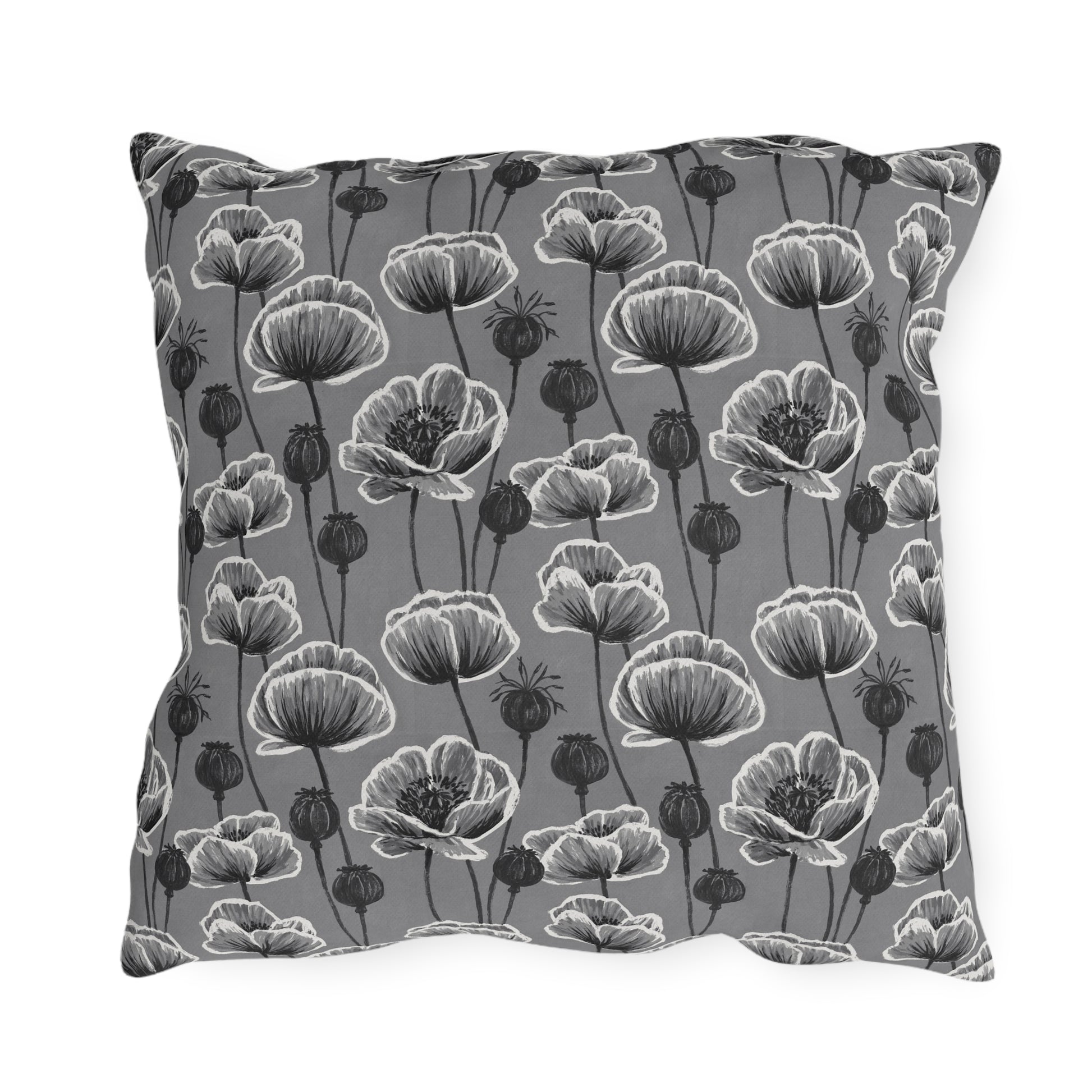 White and charcoal poppies and seed heads on grey outdoor pillow