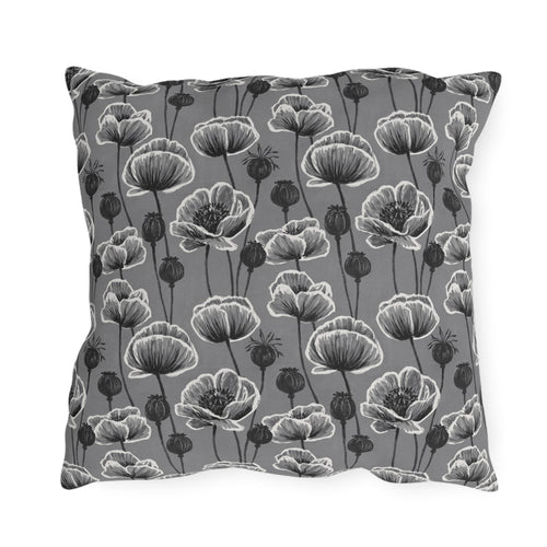 White and charcoal poppies and seed heads on grey outdoor pillow