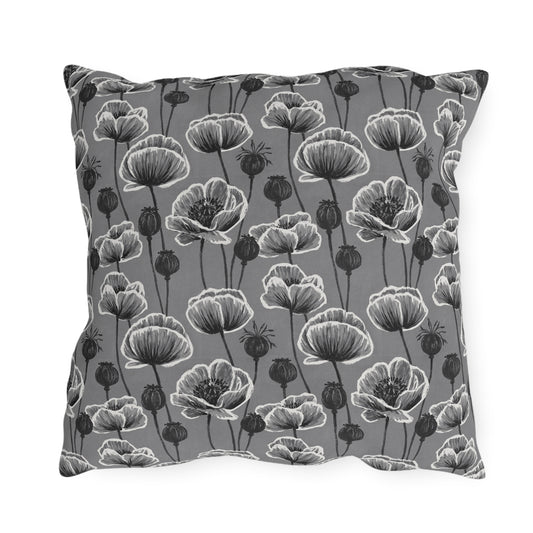 White and charcoal poppies and seed heads on grey outdoor pillow