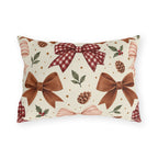 Christmas outdoor lumbar pillow with watercolor brown satin bows, red gingham bow, pinecones and holly on cream