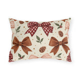 Christmas outdoor lumbar pillow with watercolor brown satin bows, red gingham bow, pinecones and holly on cream