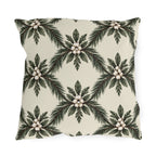 Pine sprays and white berry clusters in a symmetrical lattice on a cream outdoor pillow