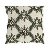 Pine sprays and white berry clusters in a symmetrical lattice on a cream outdoor pillow