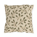 Olive leaves and pale snowberries block printed on a cream outdoor pillow