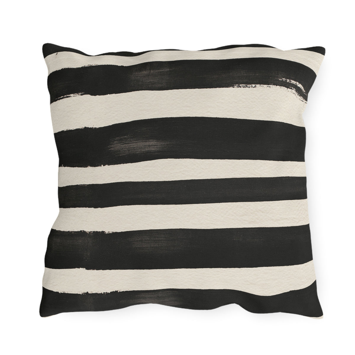 Wide black brushed stripes on a cream outdoor pillow