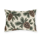 Large pinecones on pine and cedar branches on a cream outdoor lumbar pillow