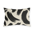 Black and cream outdoor lumbar pillow with loose abstract black brush strokes