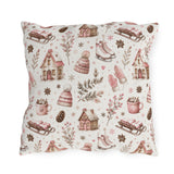 Pink cottages, wooden sleds, ice skates and bobble hats on cream outdoor pillow