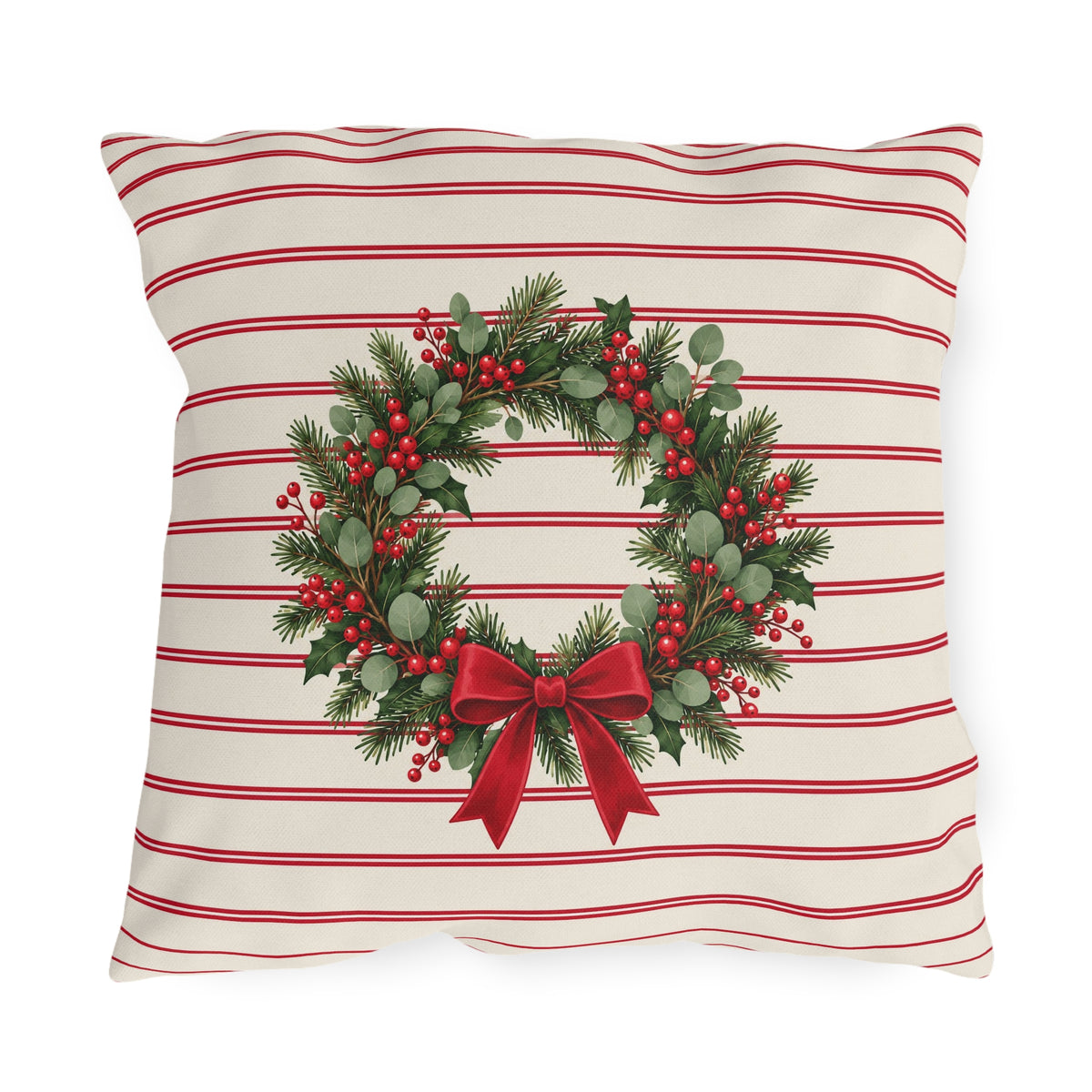 Christmas wreath outdoor pillow with a pine and berry wreath and red bow on cream with cranberry pinstripes