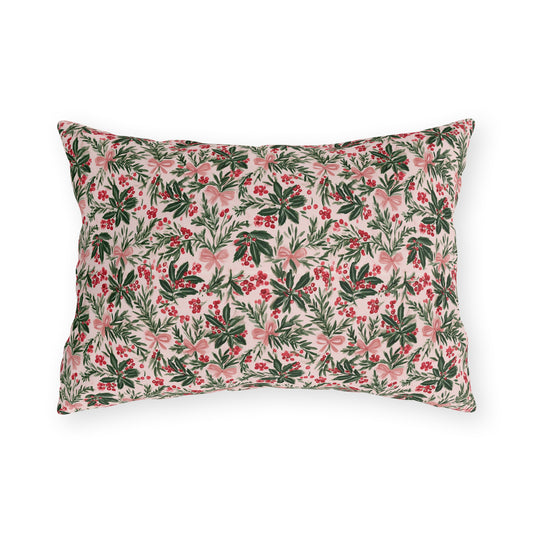 Holly, pine, red berries and pink bows on blush outdoor lumbar pillow