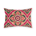 Boho outdoor lumbar pillow with Moroccan medallions in emerald green, orange and cream on raspberry pink