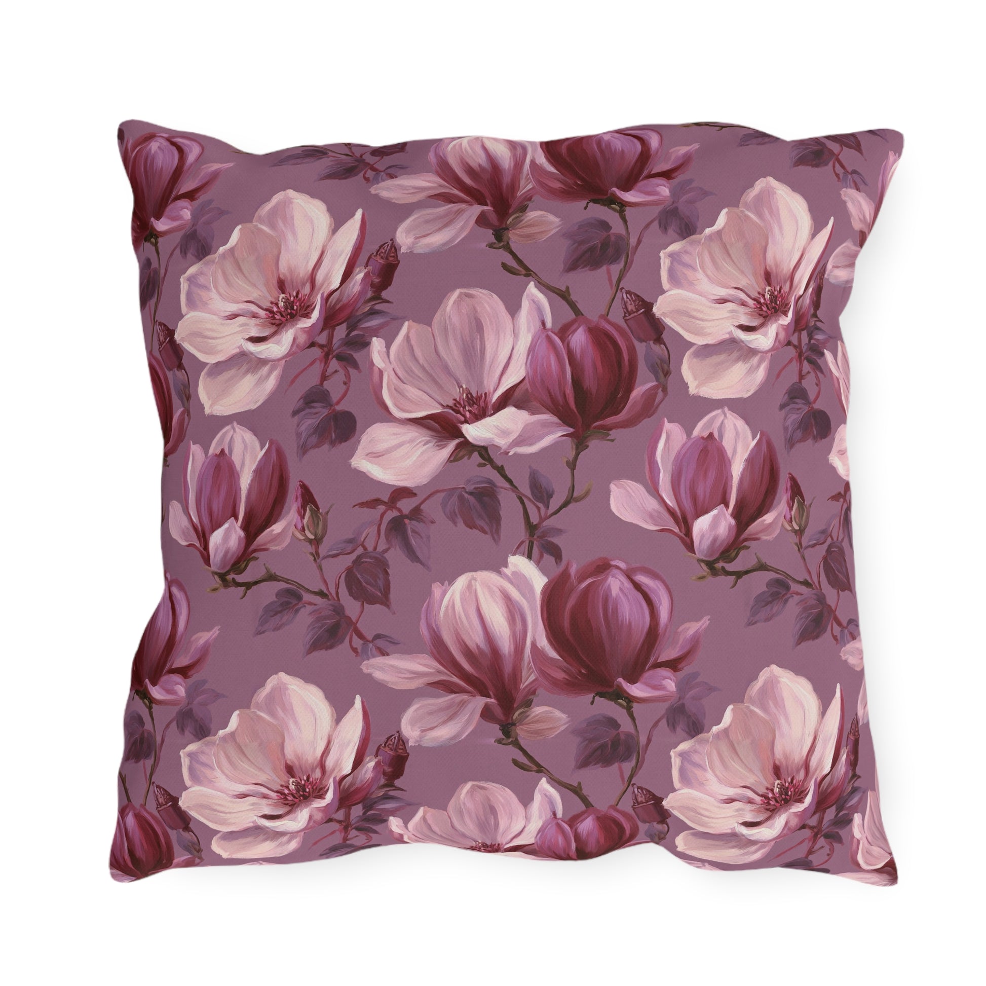 Blush and burgundy painted magnolias on mauve outdoor pillow
